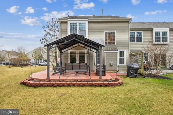a view of balcony with couch and chairs