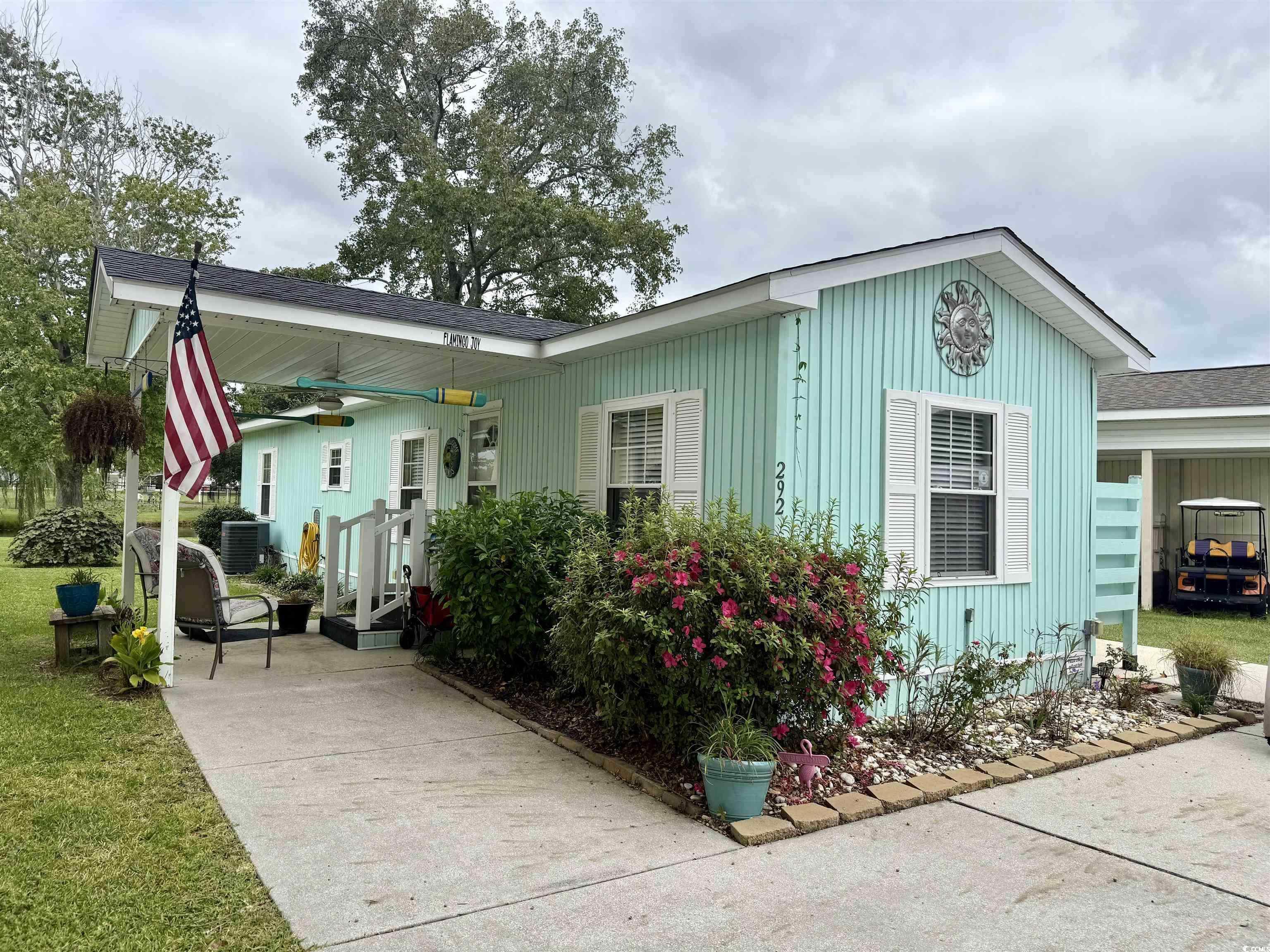 292 Flamingo Surfside Beach, SC 29575 - Photo 1 of 32 View of front facade with a ceiling fan