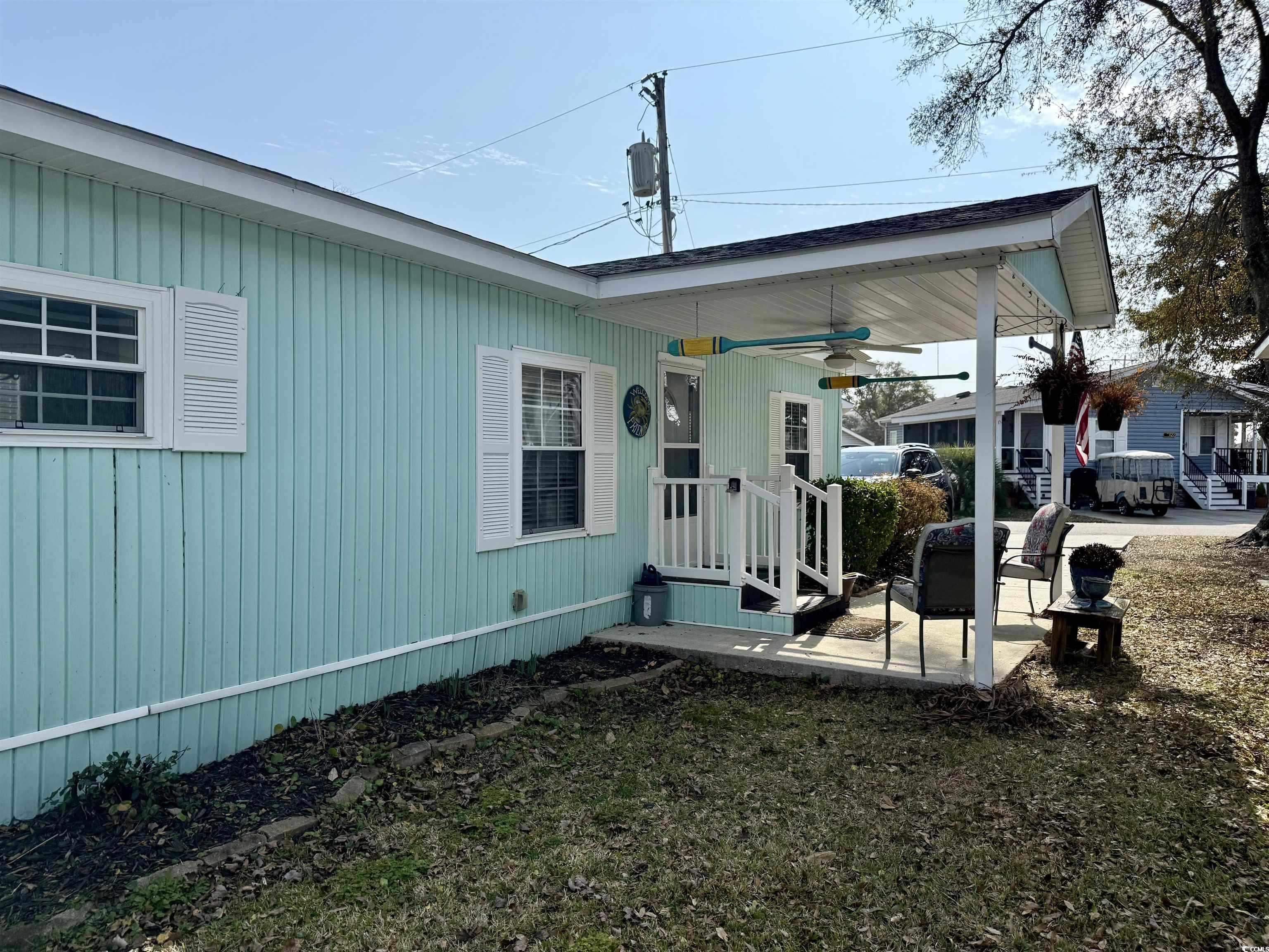 292 Flamingo Surfside Beach, SC 29575 - Photo 22 of 32 View of side of home featuring ceiling fan