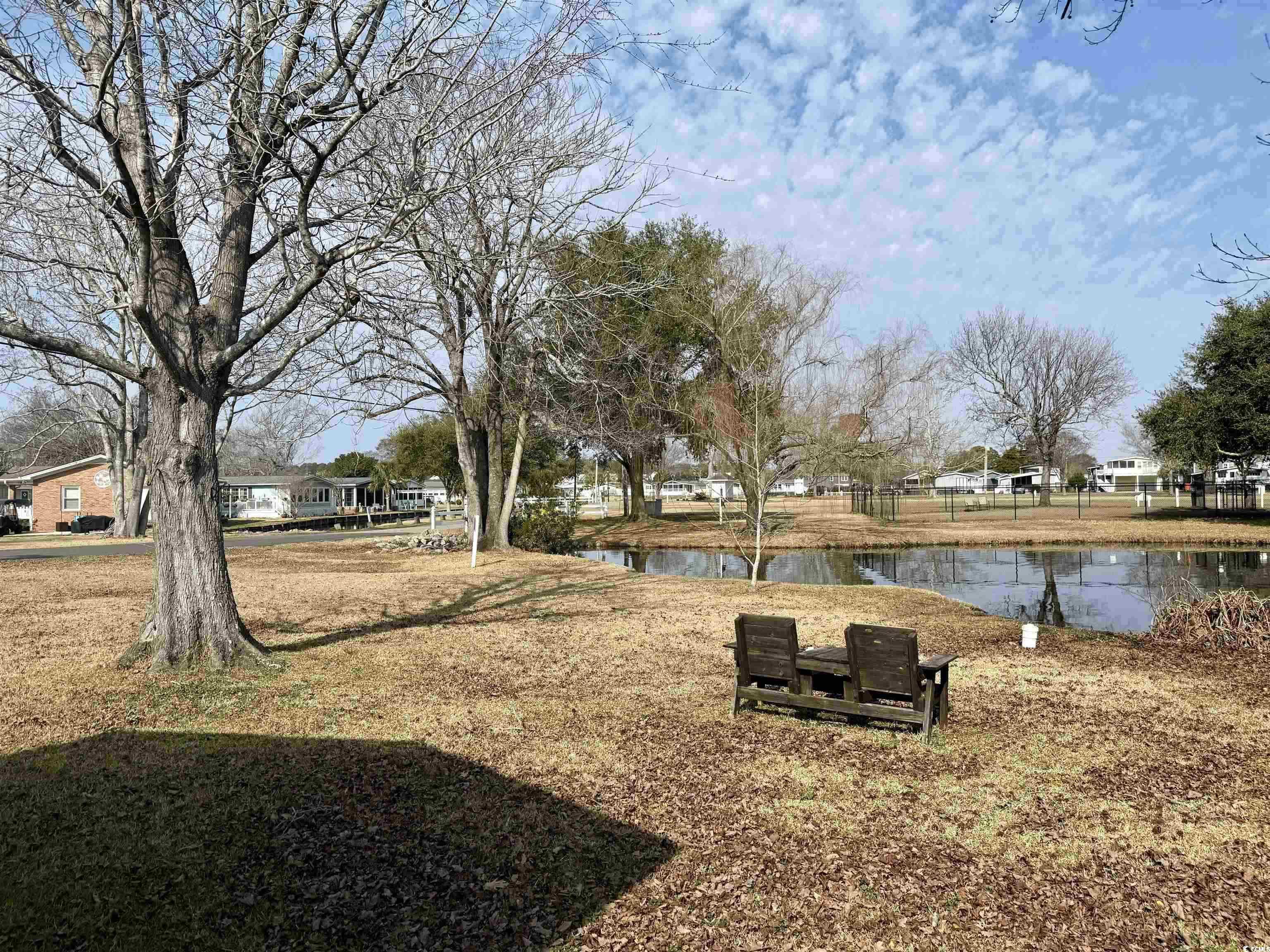 292 Flamingo Surfside Beach, SC 29575 - Photo 23 of 32 View of green lawn featuring a water view