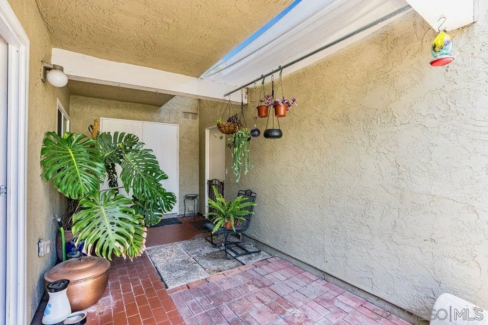 13358 Birch Tree Lane Poway, CA 92064 - Photo 11 of 16 a potted plant sitting in front of a door