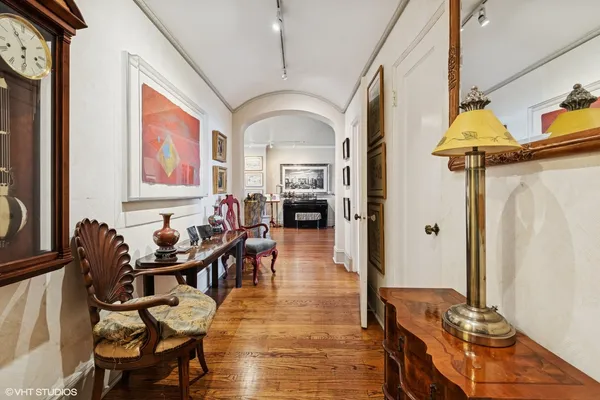 a view of a livingroom with furniture window and wooden floor