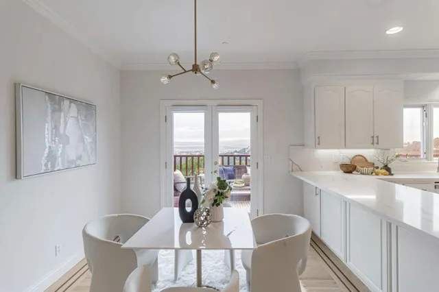 a view of balcony with wooden floor and fence