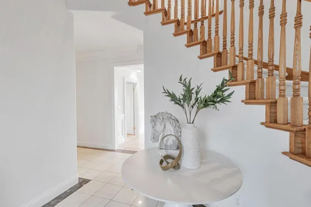 an aerial view of a house with a yard and garden