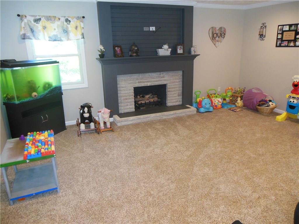 119 Spiker Road Cabot, PA 16023 - Photo 17 of 25 Family room -- perfect for a play area! Gas fireplace!