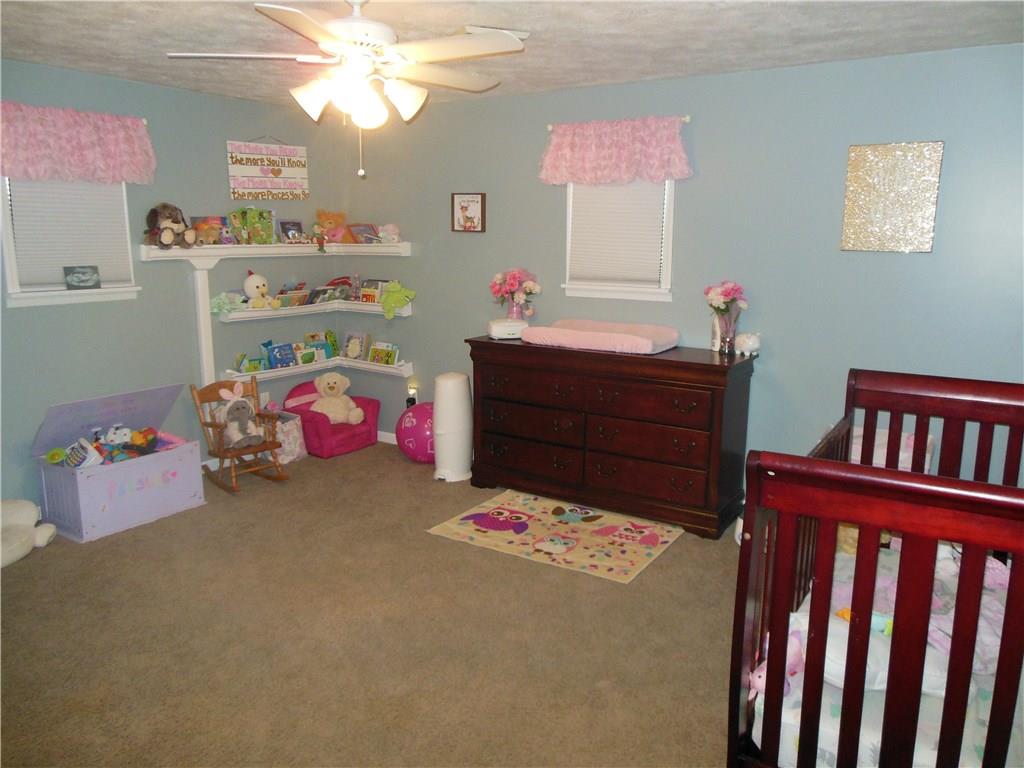 119 Spiker Road Cabot, PA 16023 - Photo 21 of 25 Large 2nd bedroom - includes double closets and ceiling fan!