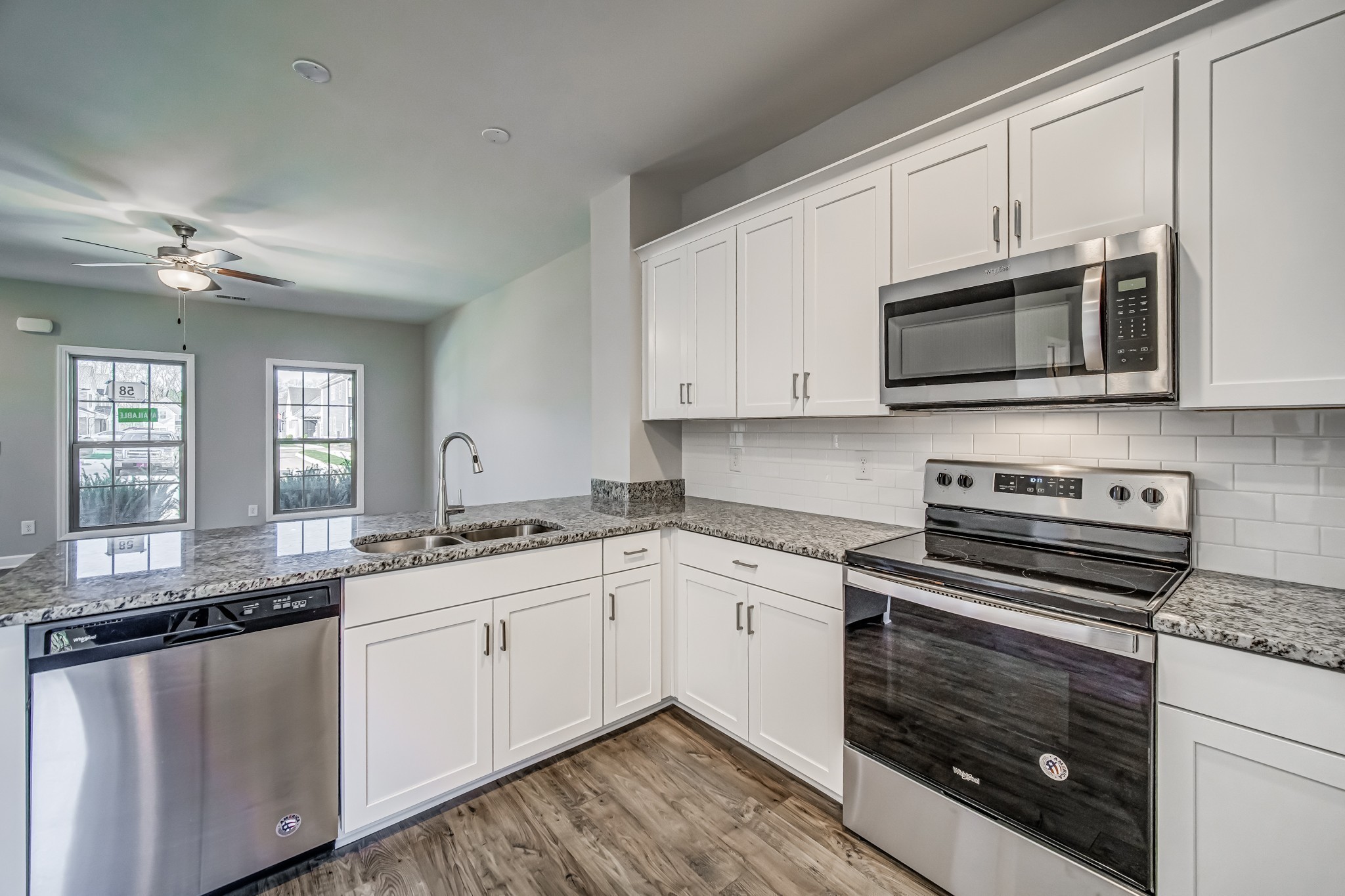 1746 Fenway Loop Antioch, TN 37013 - Photo 15 of 15 a kitchen with granite countertop a stove sink and microwave