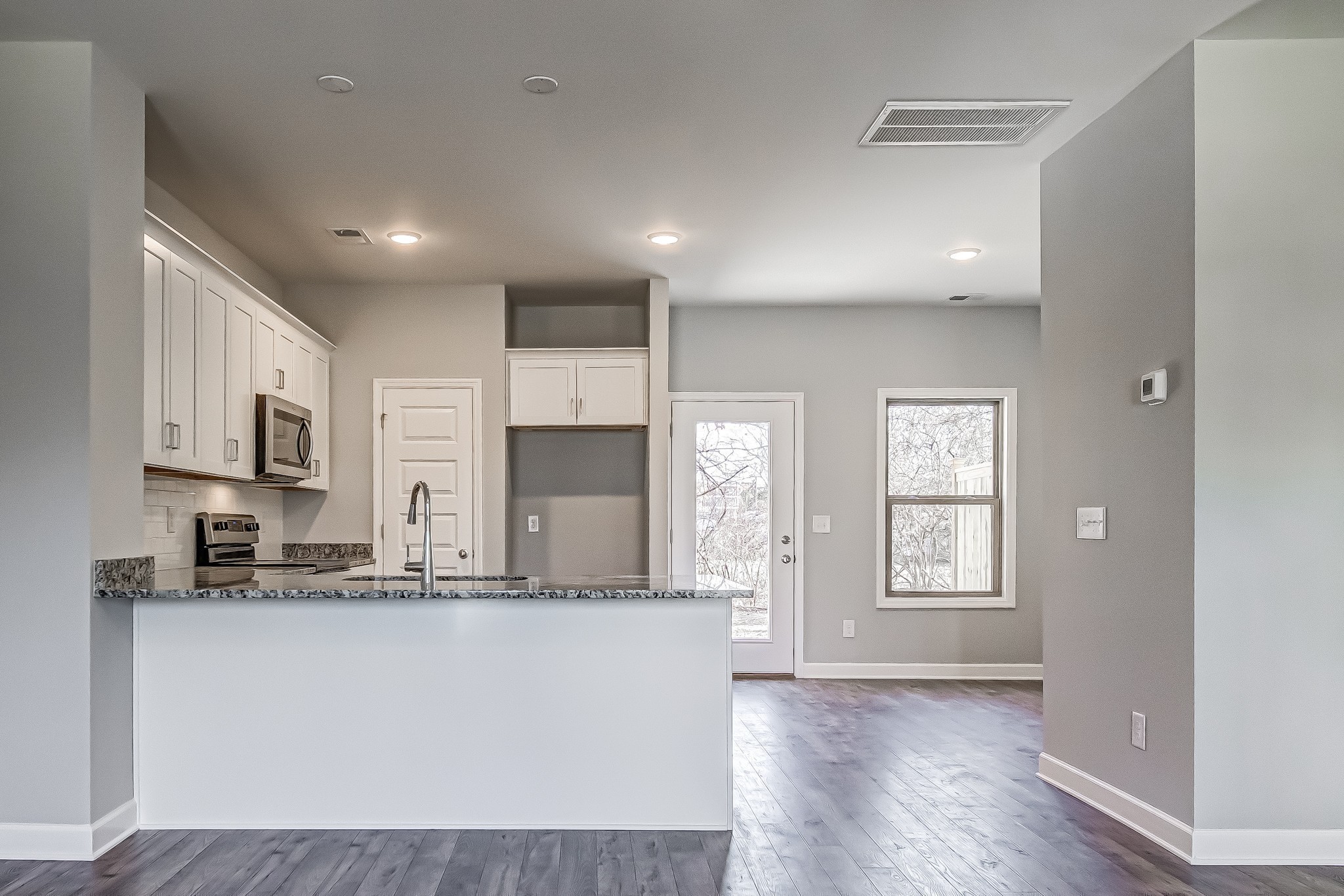 1746 Fenway Loop Antioch, TN 37013 - Photo 9 of 15 a view of kitchen with kitchen island and stainless steel appliances