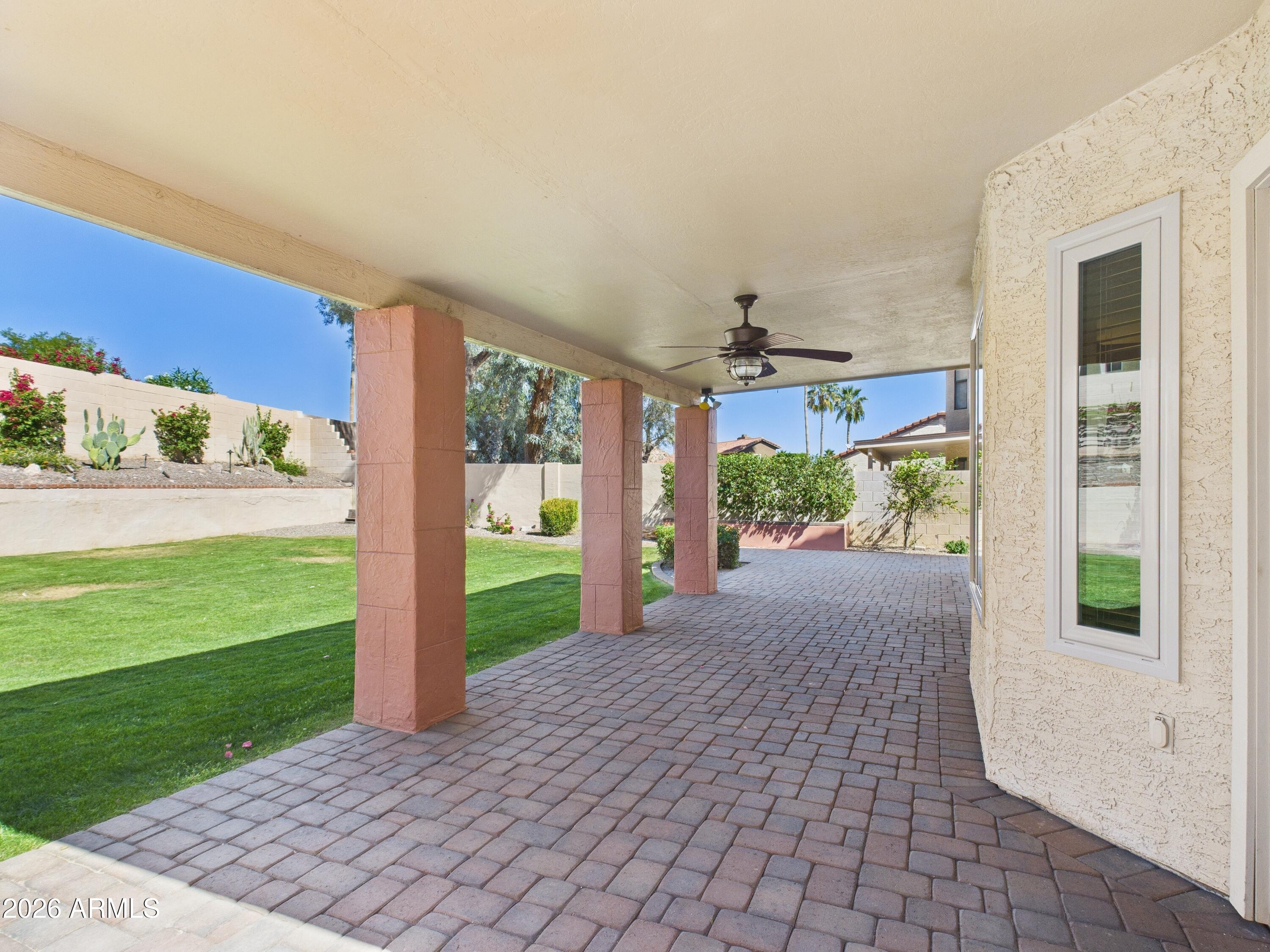 2750 East Rock Wren Road Phoenix, AZ 85048 - Photo 16 of 90 a view of a porch and a yard