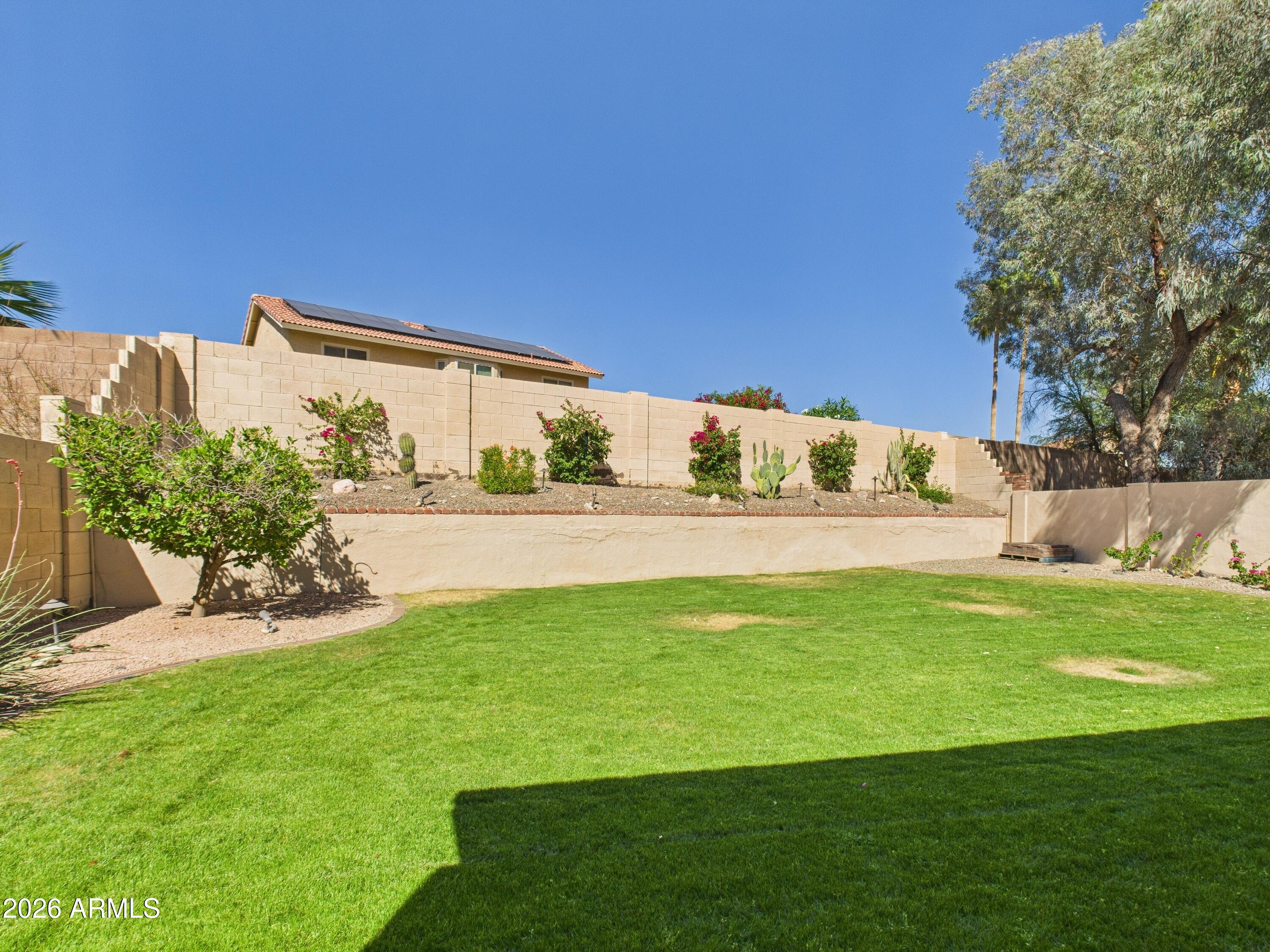2750 East Rock Wren Road Phoenix, AZ 85048 - Photo 17 of 90 a view of a golf course with a garden