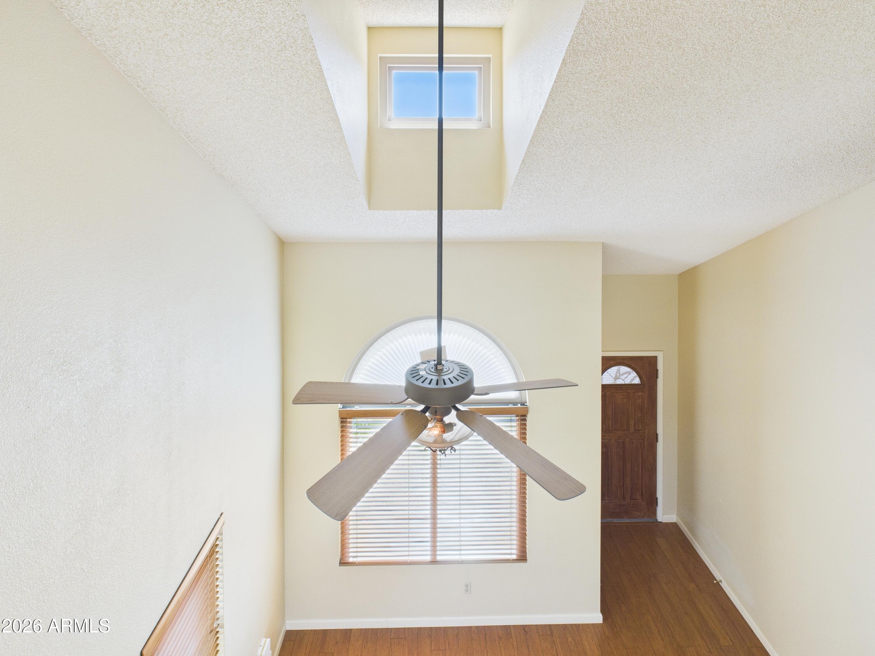 2750 East Rock Wren Road Phoenix, AZ 85048 - Photo 42 of 90 a room with a window and a chandelier