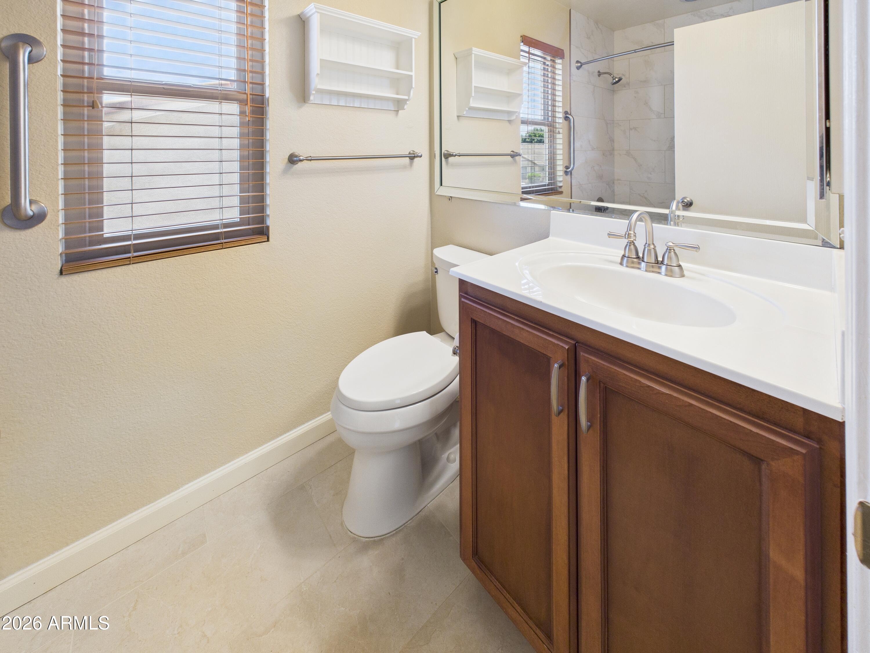 2750 East Rock Wren Road Phoenix, AZ 85048 - Photo 44 of 90 a bathroom with a sink and a toilet