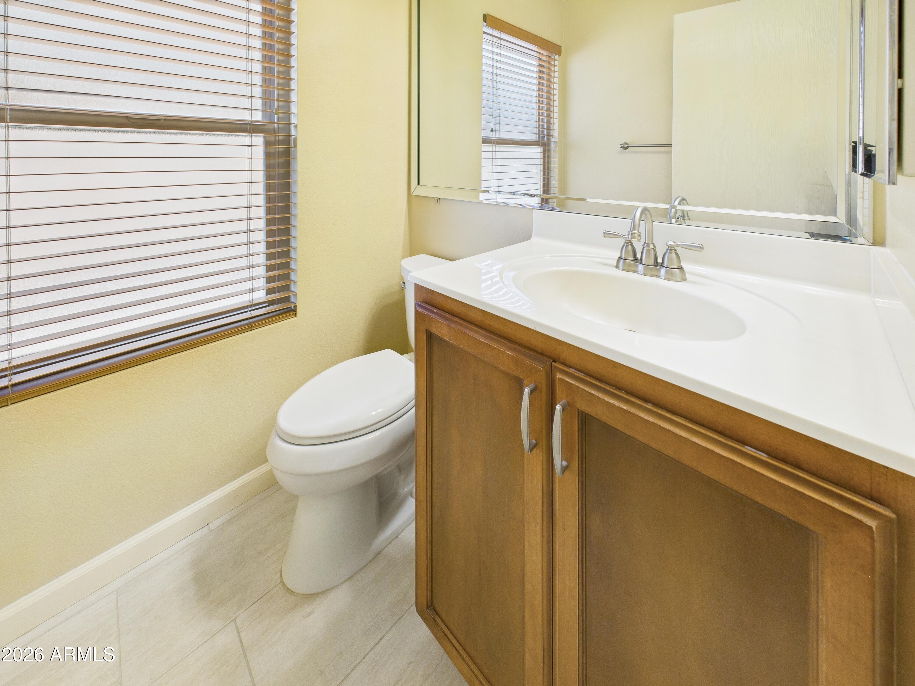 2750 East Rock Wren Road Phoenix, AZ 85048 - Photo 55 of 90 a bathroom with a sink and a toilet