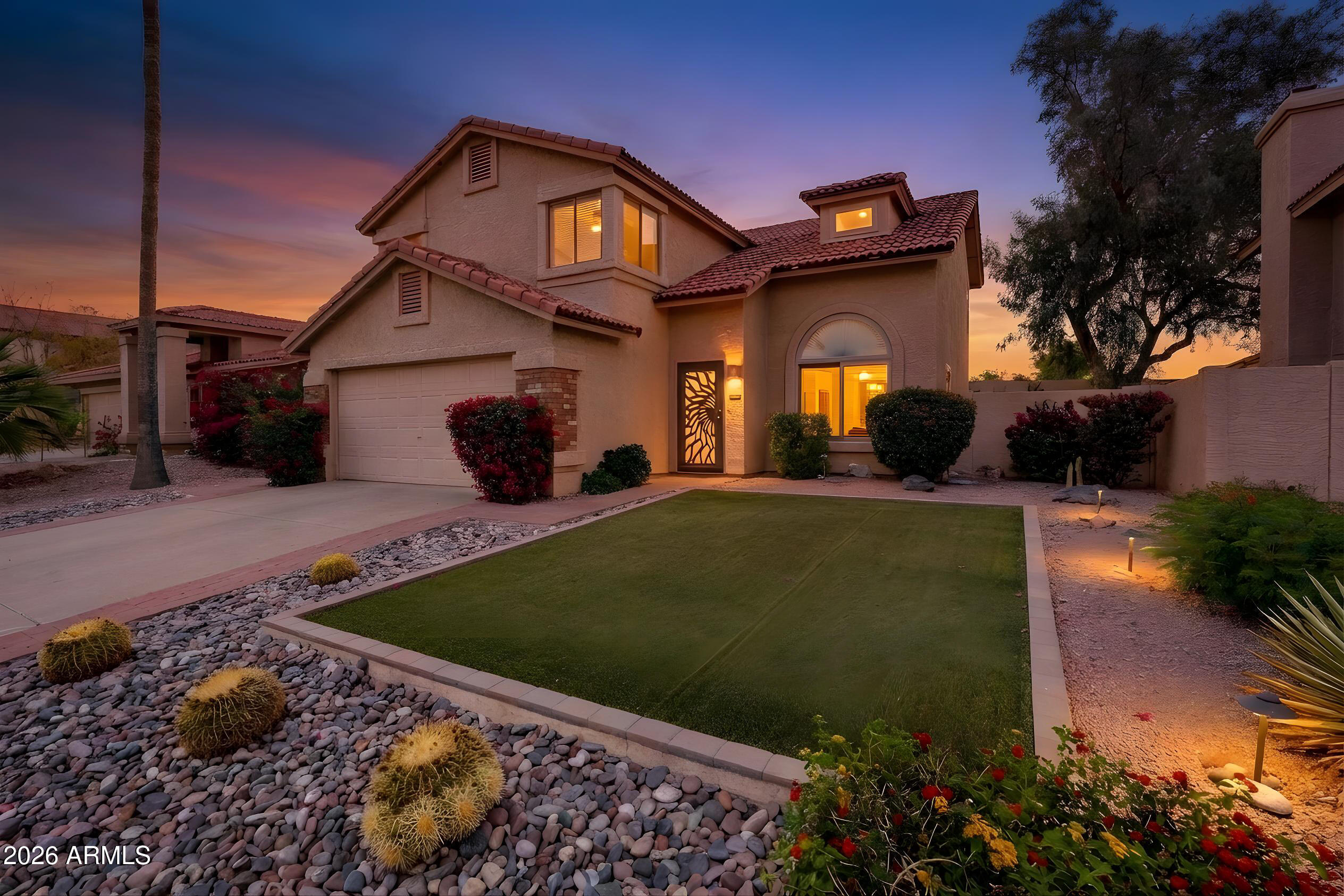 2750 East Rock Wren Road Phoenix, AZ 85048 - Photo 5 of 90 a front view of a house with garden