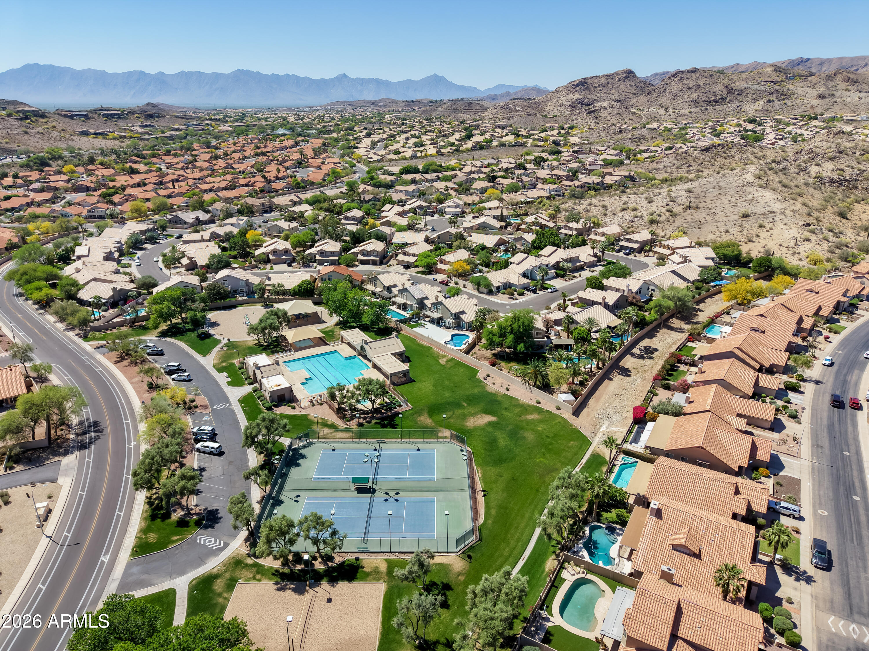 2750 East Rock Wren Road Phoenix, AZ 85048 - Photo 62 of 90 an aerial view of residential houses with outdoor space and trees