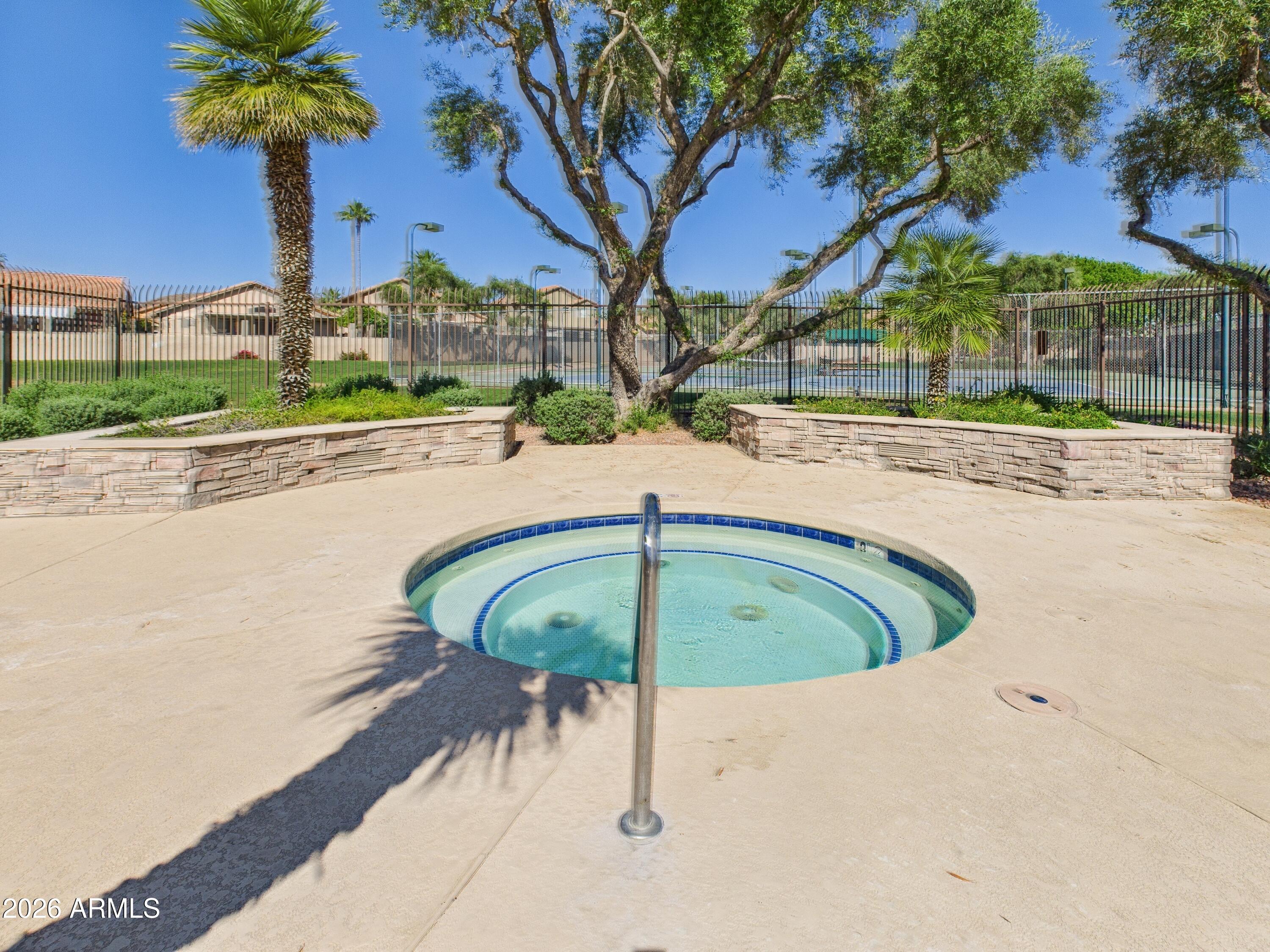 2750 East Rock Wren Road Phoenix, AZ 85048 - Photo 65 of 90 a view of a swimming pool with a yard