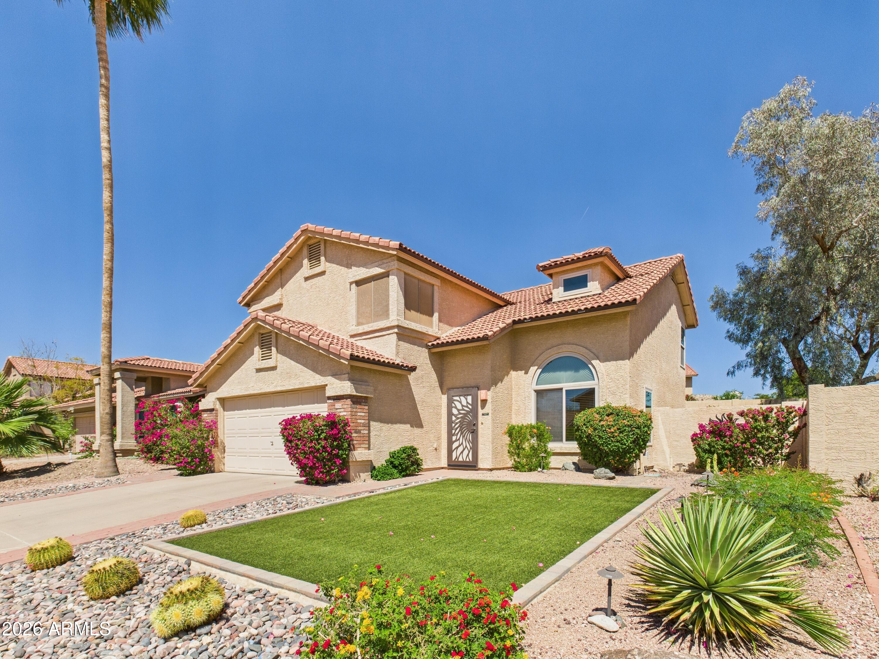 2750 East Rock Wren Road Phoenix, AZ 85048 - Photo 80 of 90 a front view of a house with a yard