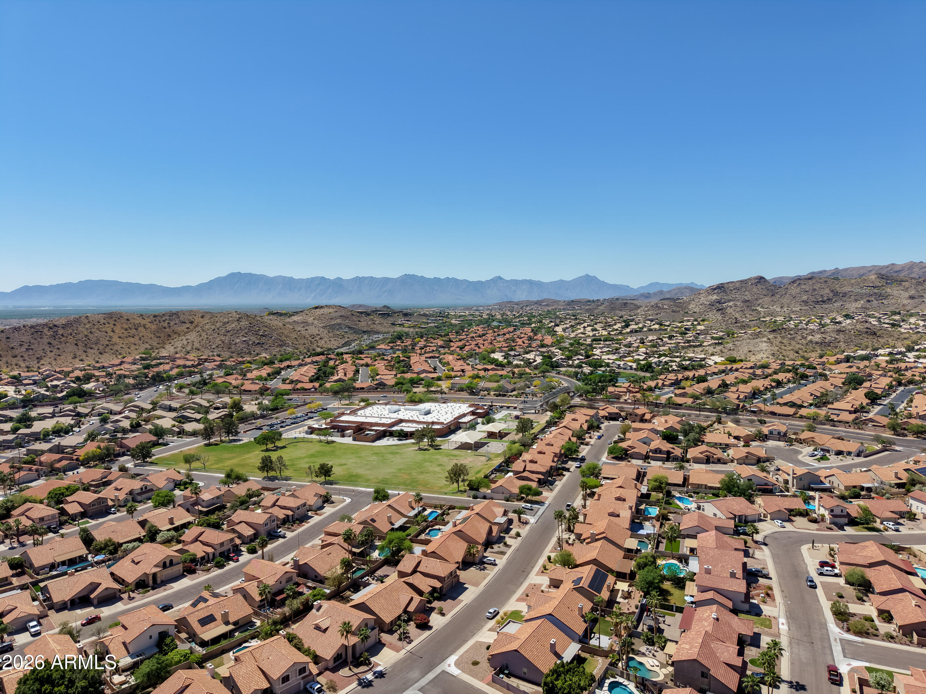 2750 East Rock Wren Road Phoenix, AZ 85048 - Photo 86 of 90 an aerial view of residential houses with outdoor space and trees