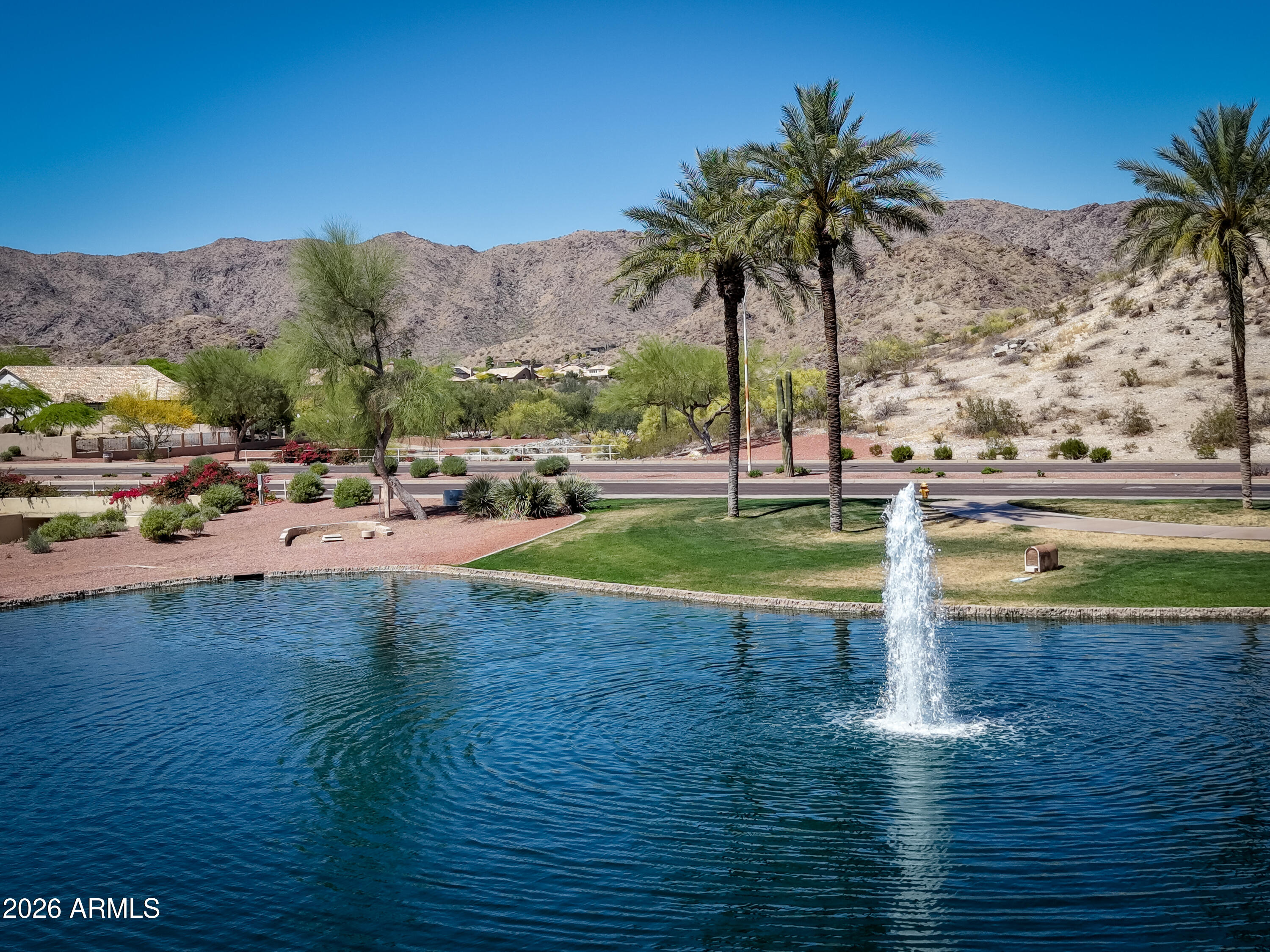 2750 East Rock Wren Road Phoenix, AZ 85048 - Photo 88 of 90 a view of swimming pool with a table and chairs