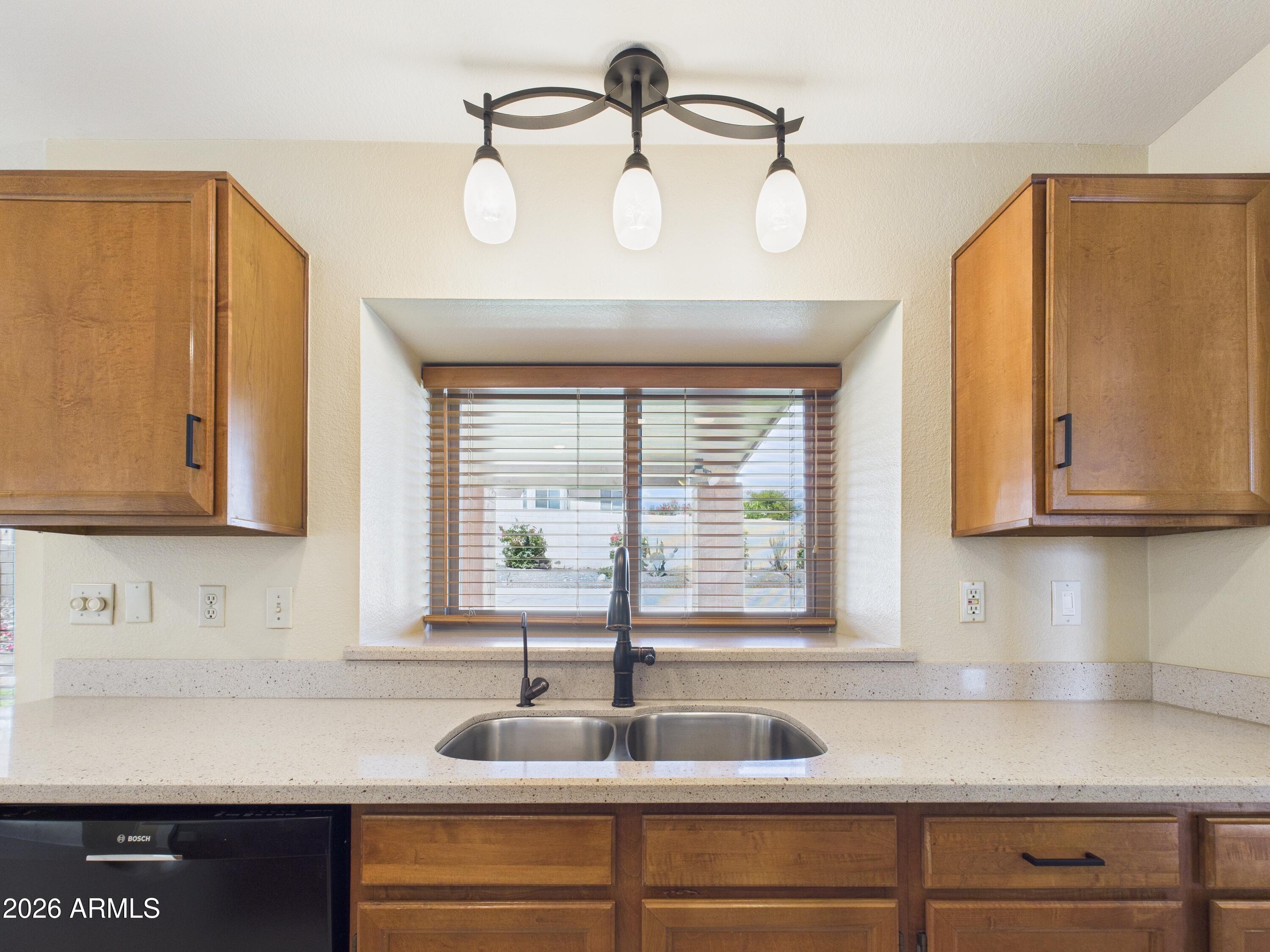 2750 East Rock Wren Road Phoenix, AZ 85048 - Photo 8 of 90 a kitchen with a sink and a window