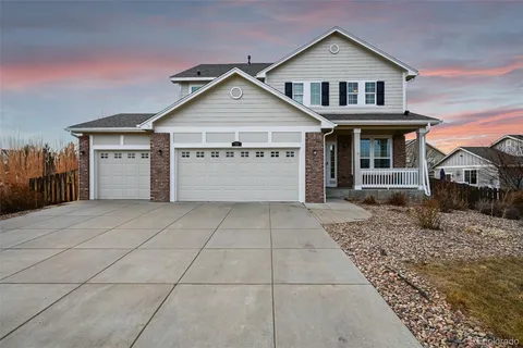 a front view of a house with a garage