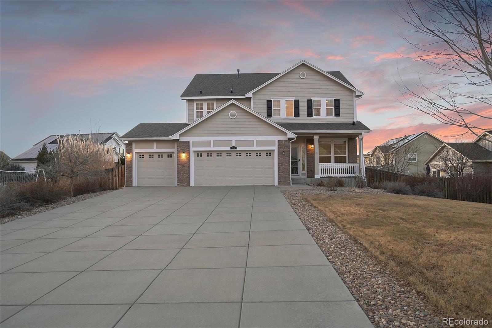 35 North Newcastle Way Aurora, CO 80018 - Photo 44 of 45 a front view of a house with a yard and garage