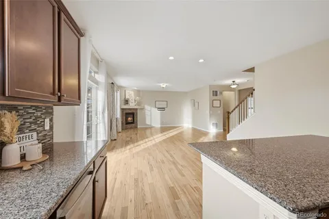 a spacious bathroom with a granite countertop sink and a granite counter top