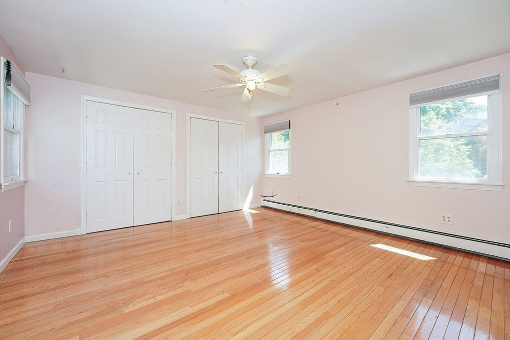 456 Gleasondale Road Stow, MA 01775 - Photo 19 of 30 wooden floor in an empty room with a window