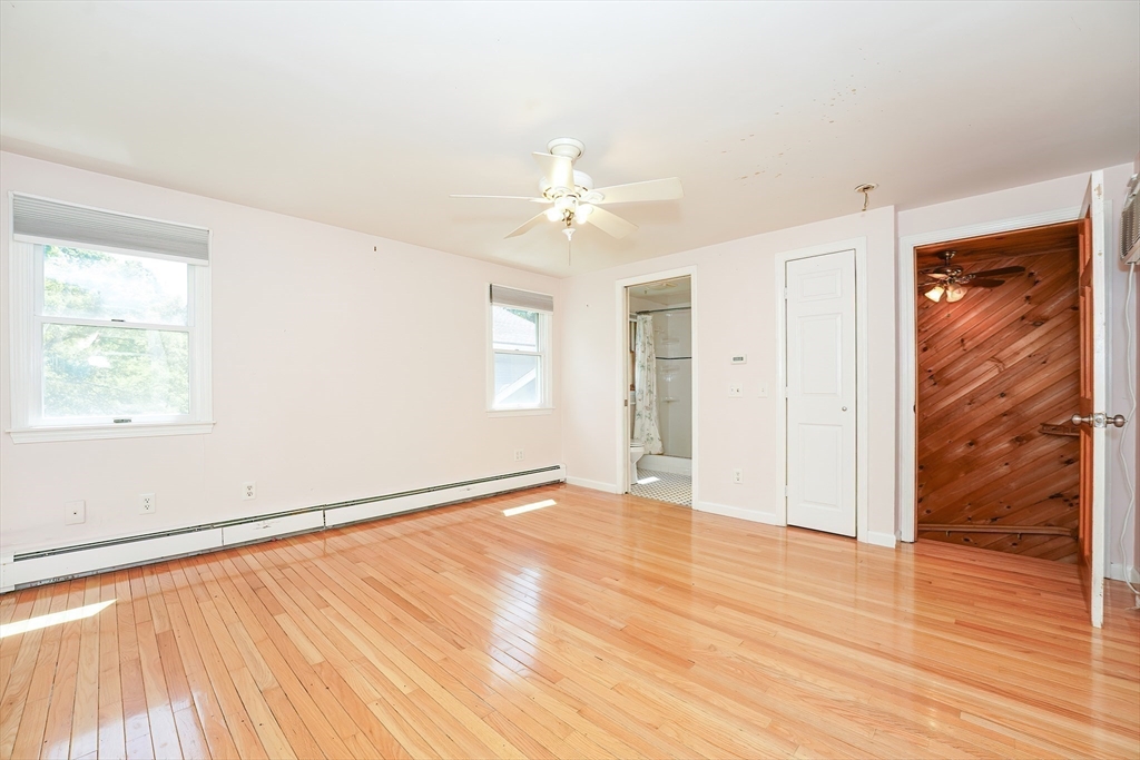 456 Gleasondale Road Stow, MA 01775 - Photo 20 of 30 wooden floor in an empty room with a window