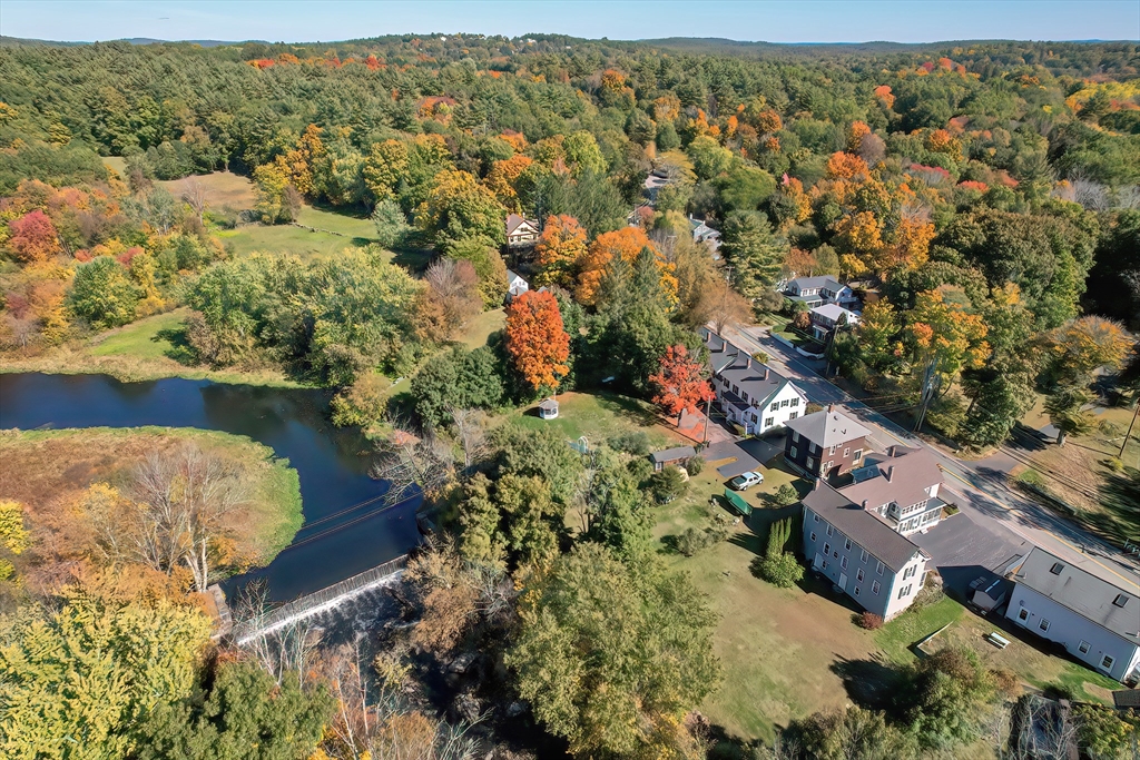 456 Gleasondale Road Stow, MA 01775 - Photo 26 of 30 an aerial view of residential houses with outdoor space