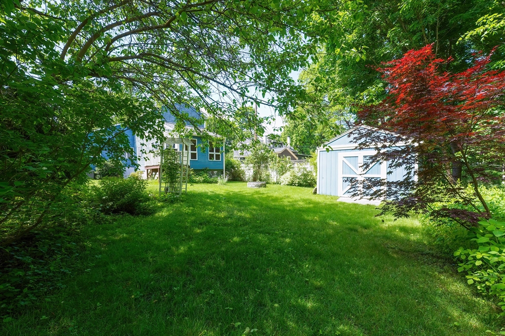 456 Gleasondale Road Stow, MA 01775 - Photo 27 of 30 a backyard of a house with lots of green space