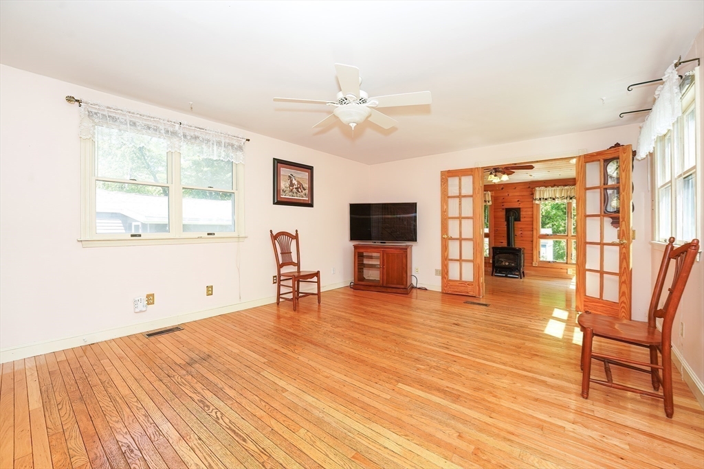 456 Gleasondale Road Stow, MA 01775 - Photo 4 of 30 a living room with furniture and a flat screen tv