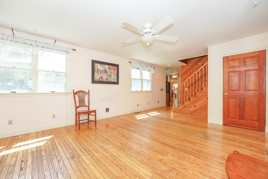 456 Gleasondale Road Stow, MA 01775 - Photo 6 of 30 a view of a livingroom with wooden floor and a window