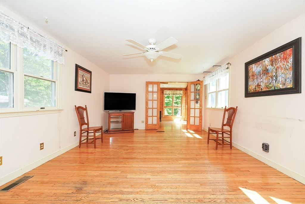 456 Gleasondale Road Stow, MA 01775 - Photo 7 of 30 a view of a livingroom with furniture window and wooden floor