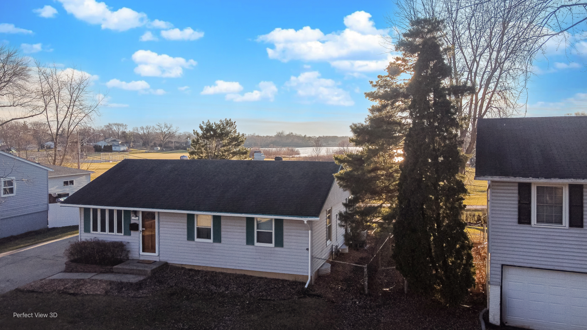 216 Kosan Circle Streamwood, IL 60107 - Photo 33 of 34 a view of a house with a yard