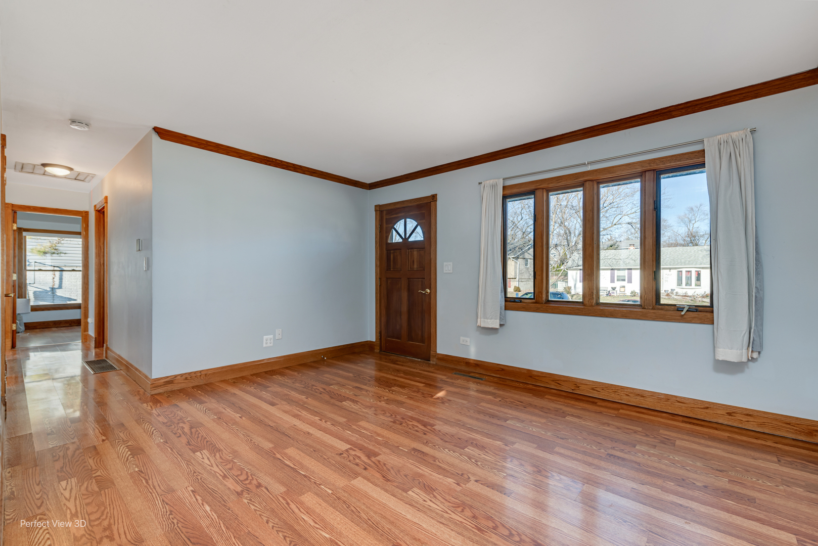216 Kosan Circle Streamwood, IL 60107 - Photo 5 of 34 a view of an empty room with window and wooden floor