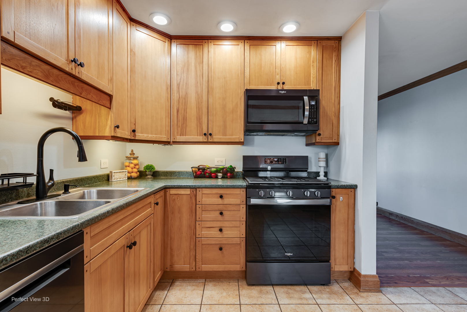 216 Kosan Circle Streamwood, IL 60107 - Photo 9 of 34 a kitchen with stainless steel appliances granite countertop a stove and a sink
