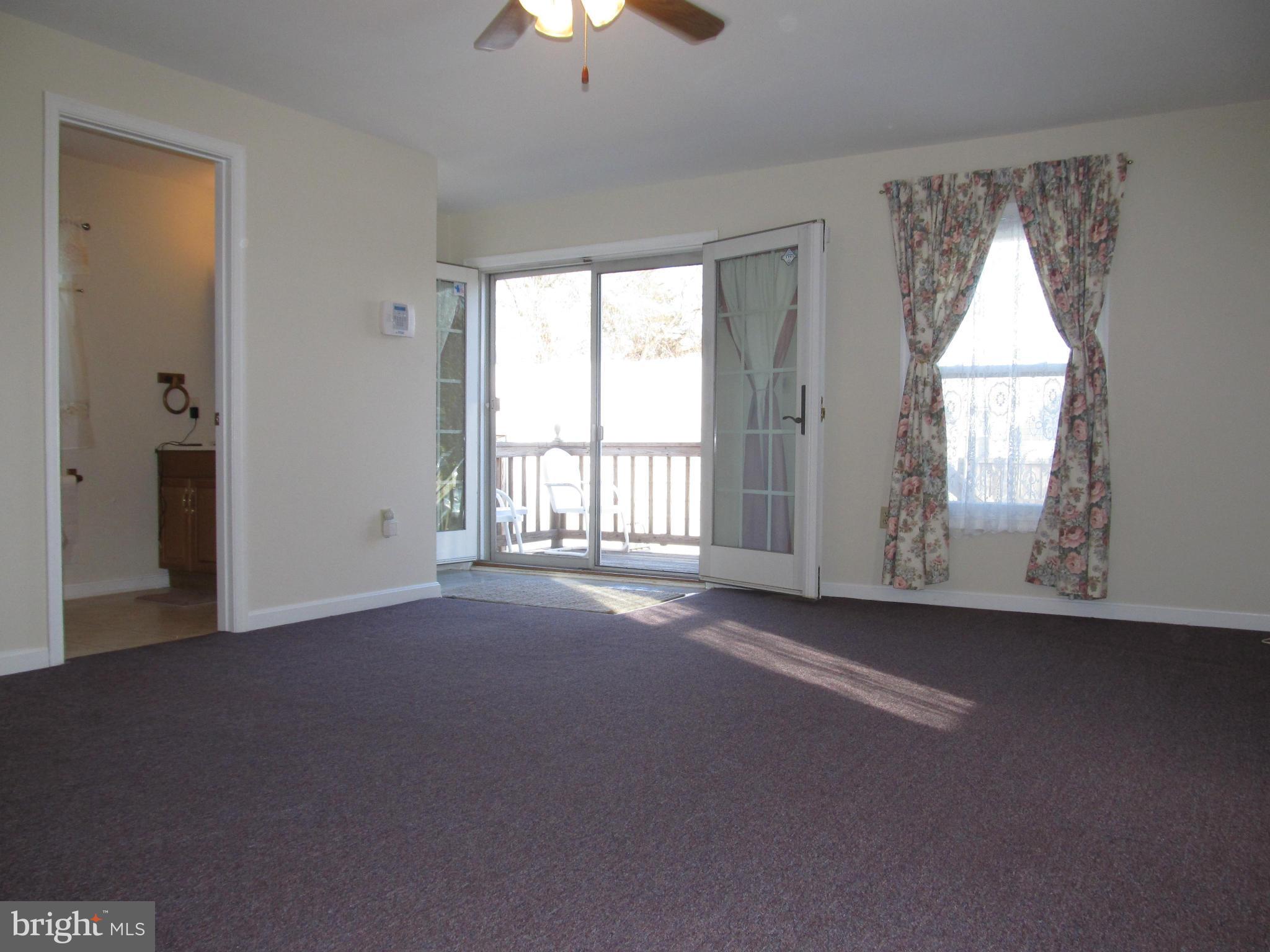 4310 Maple Road Morningside, MD 20746 - Photo 3 of 21 an empty room with windows and closet
