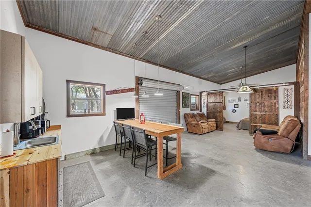 a view of a livingroom with furniture and windows