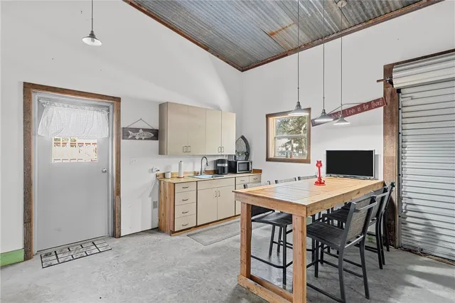 a kitchen with a table and chairs