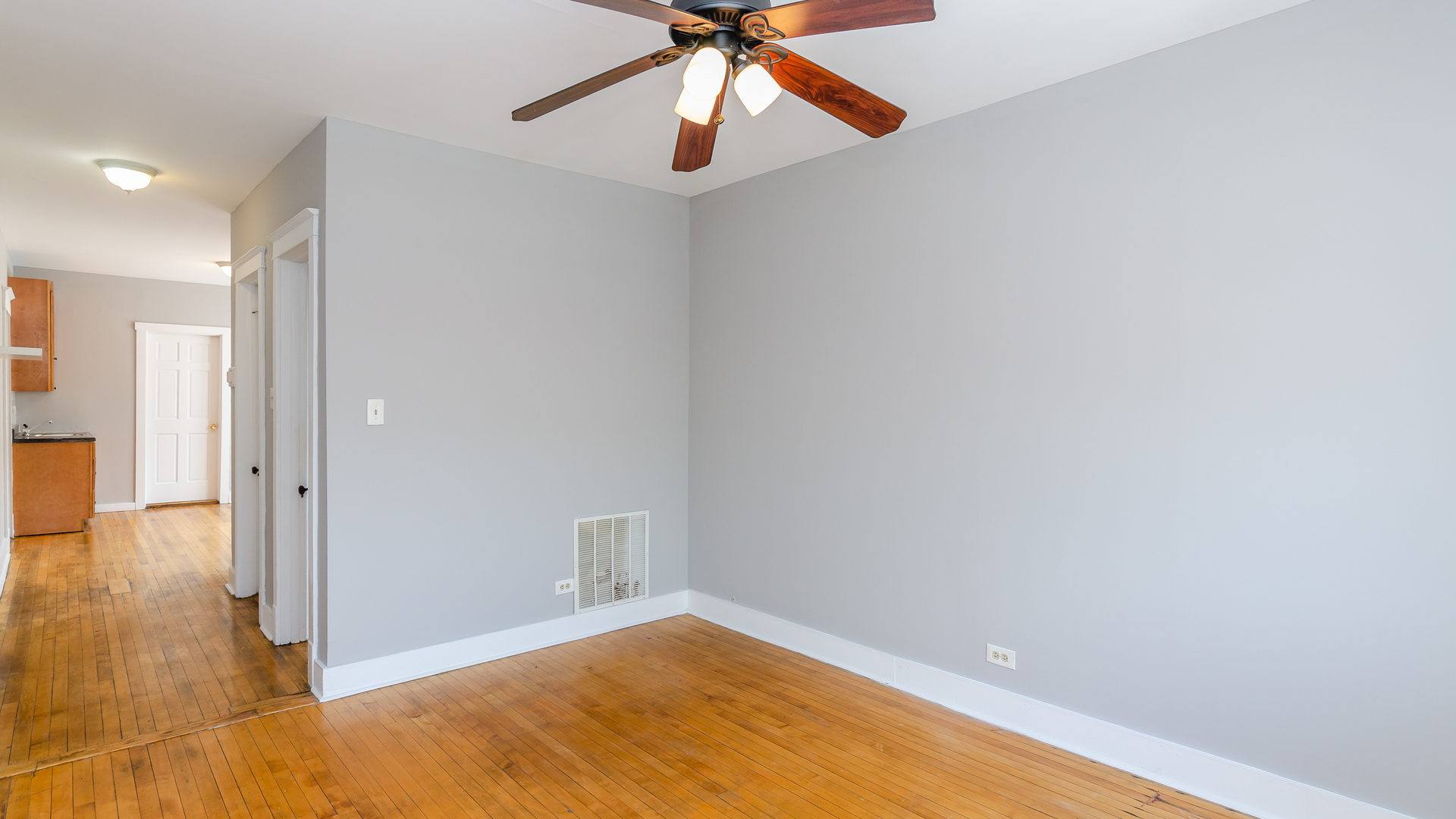 2639 West 25th Street, Unit 2F Chicago, IL 60608 - Photo 5 of 11 a view of empty room with wooden floor