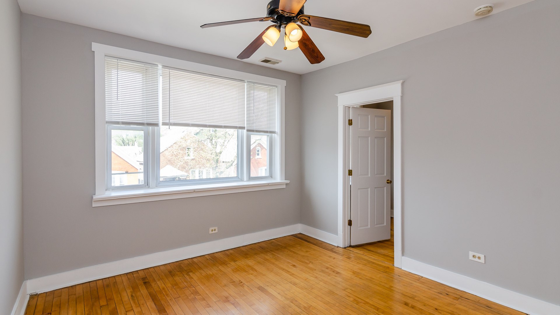 2639 West 25th Street, Unit 2F Chicago, IL 60608 - Photo 6 of 11 a view of an empty room with window and wooden floor