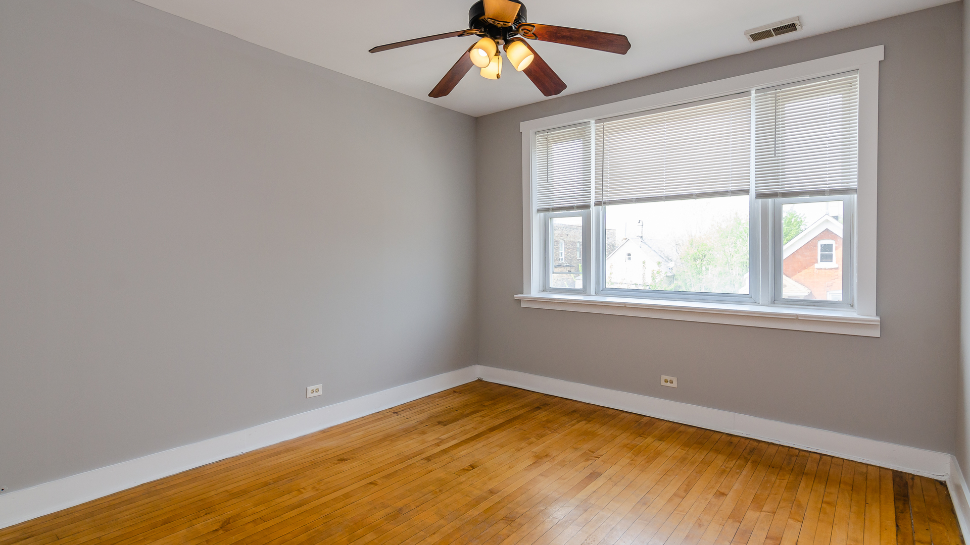 2639 West 25th Street, Unit 2F Chicago, IL 60608 - Photo 7 of 11 a view of a room with wooden floor and windows