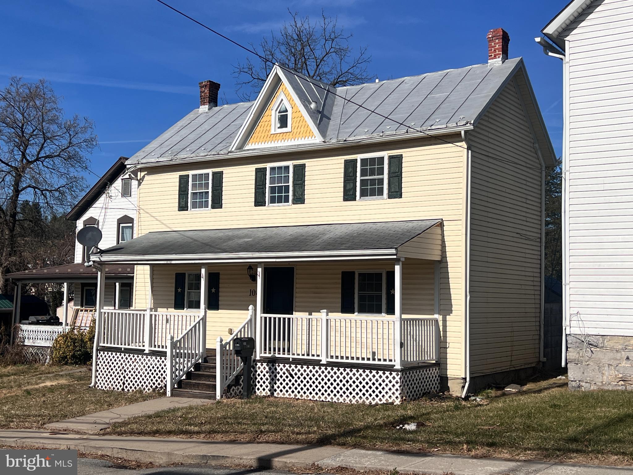 Front with full porch.