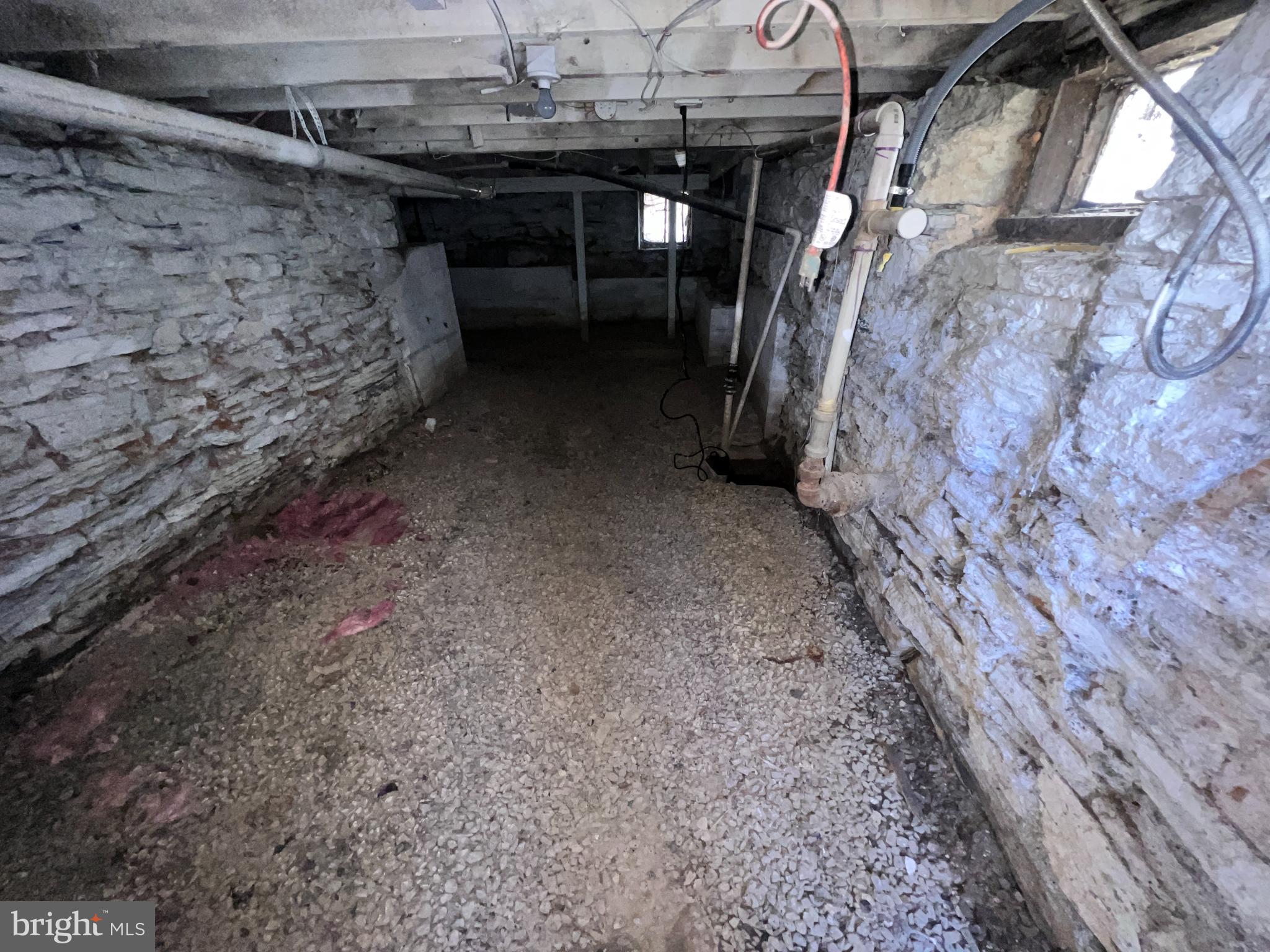 104 West High Street Hancock, MD 21750 - Photo 26 of 28 Spacious, unfinished basement with stone walls.