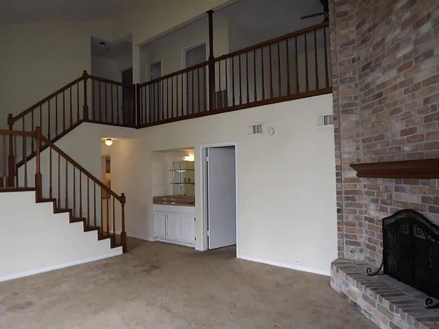 a view of staircase with fireplace
