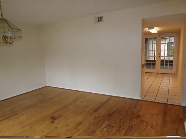 a view of an empty room and window