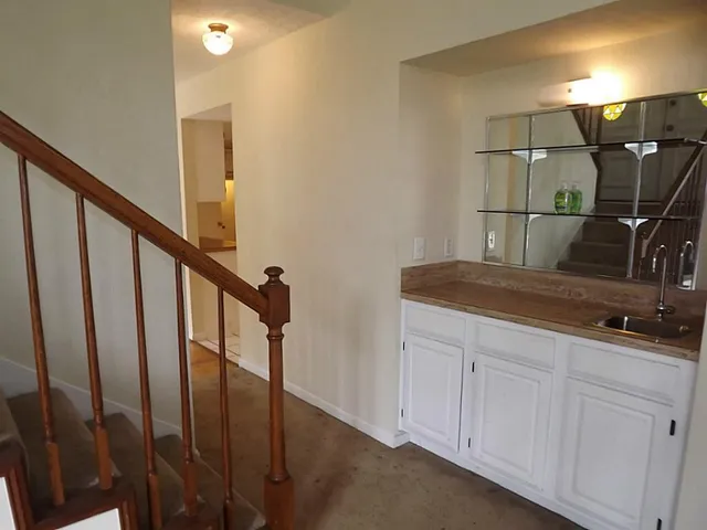 a bathroom with a sink and mirror
