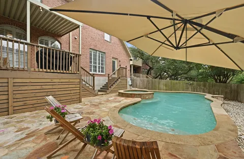 a view of a backyard with sitting area