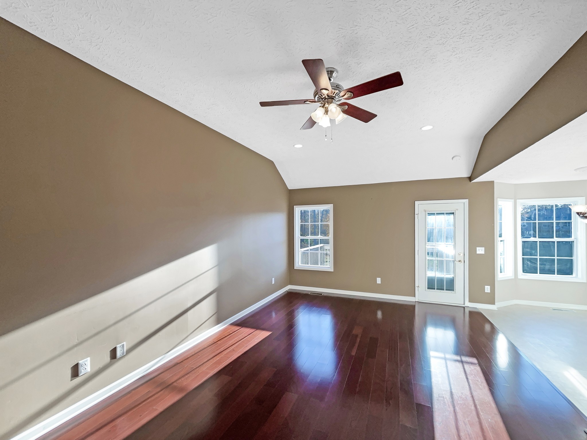 610 Chestnut Court Springfield, TN 37172 - Photo 11 of 17 a view of an empty room with window and wooden floor